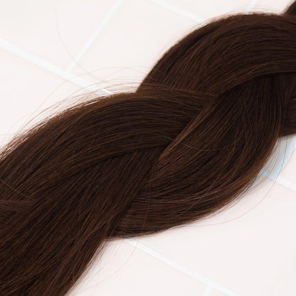 Loxys Coco weft extensions, braided on a neutral background