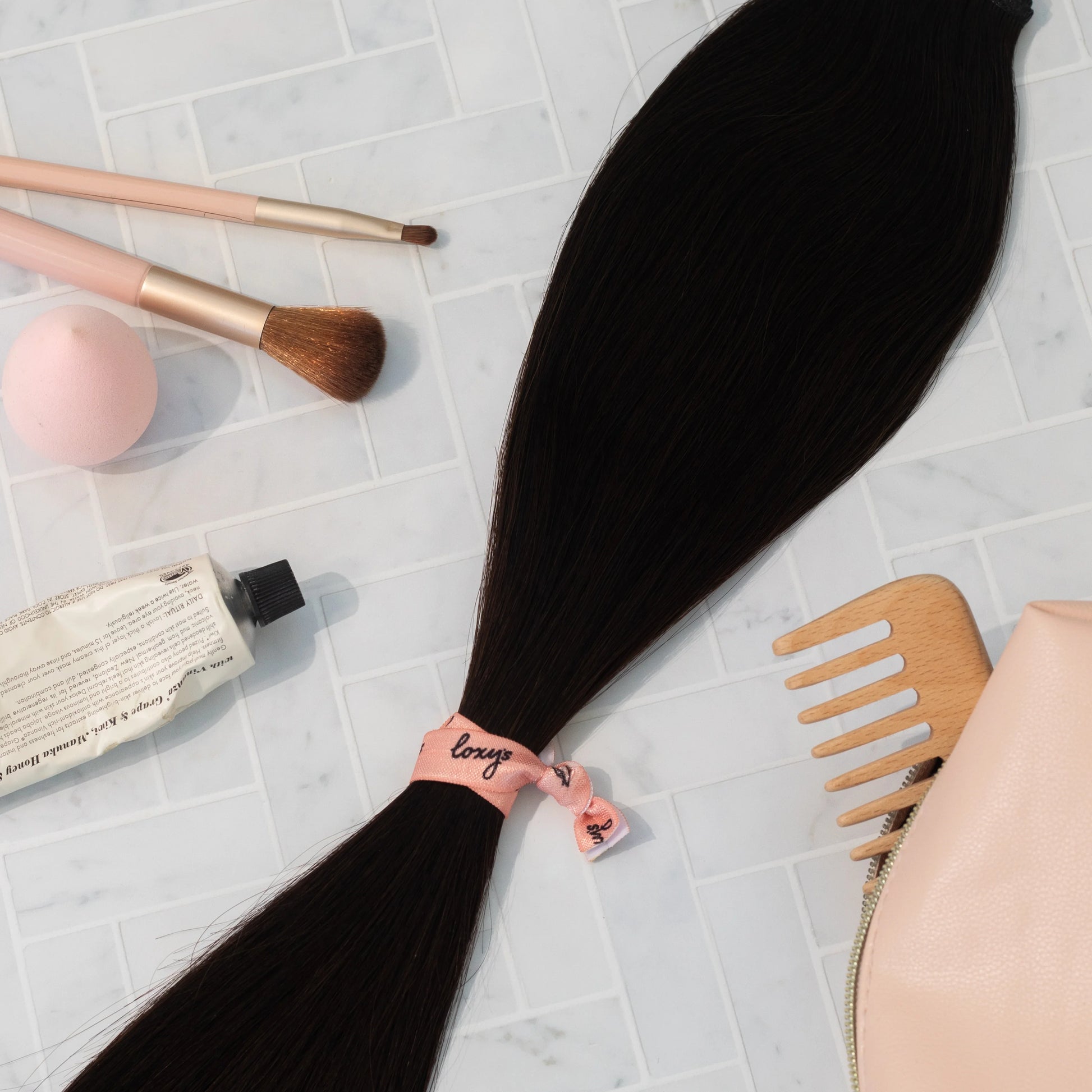 Deep Dark weft extensions on a grey surface