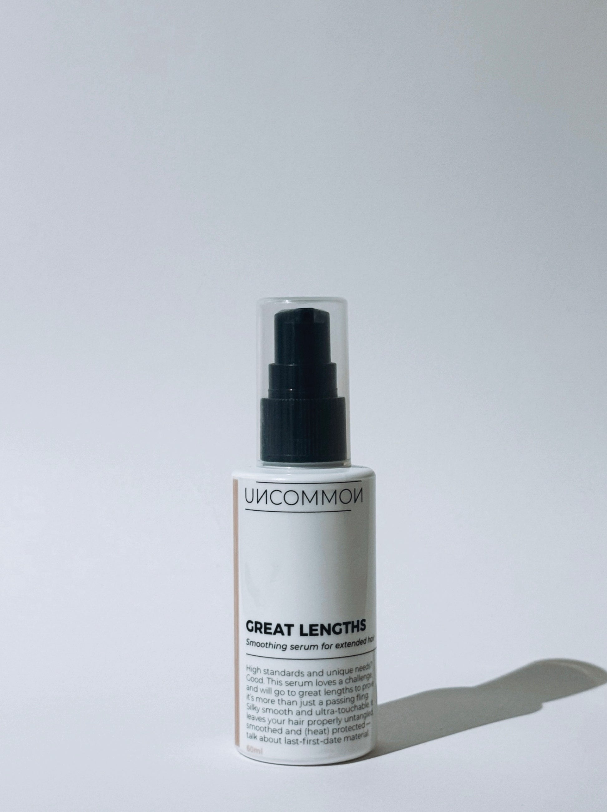 Uncommon Great Lengths hair serum bottle on a white background
