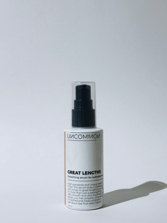 Uncommon Great Lengths hair serum bottle on a white background