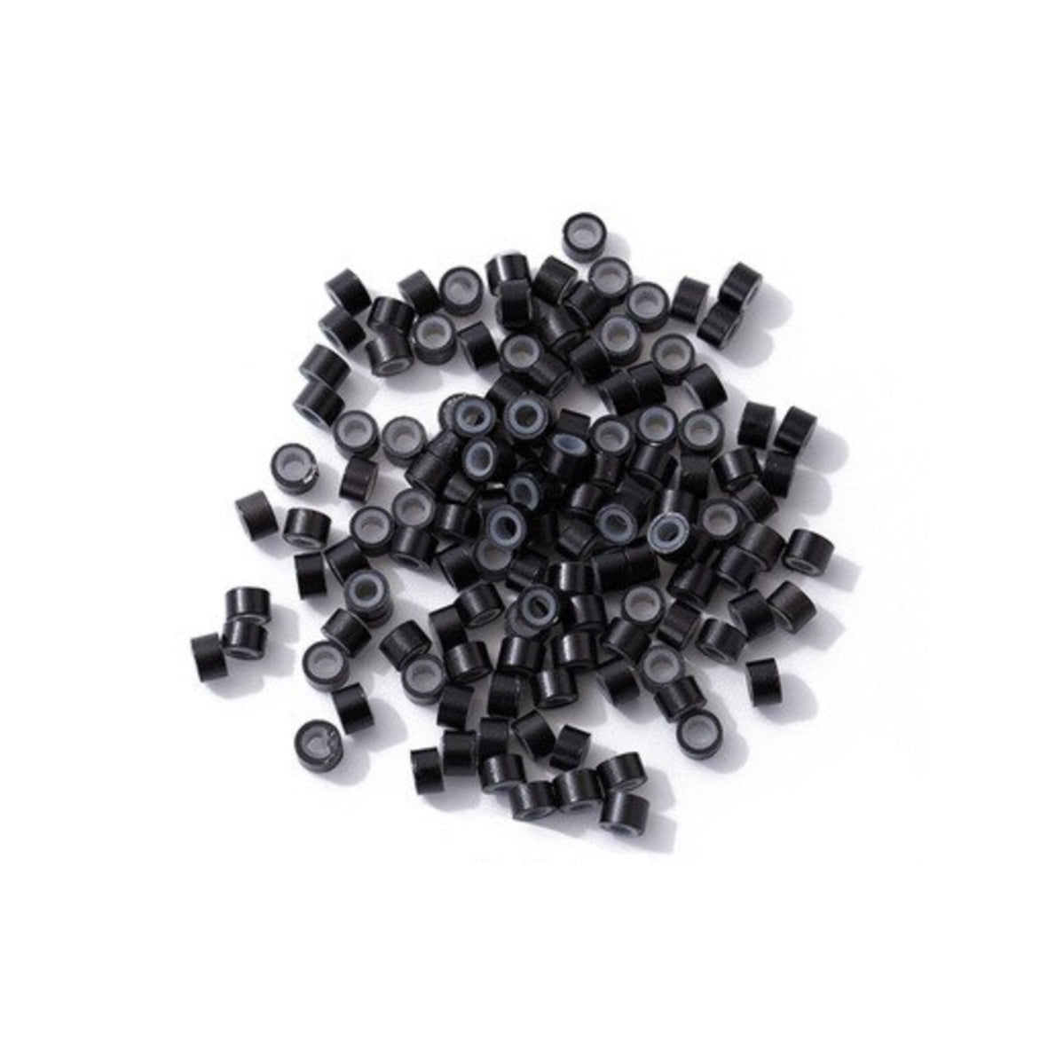 Black silicone lined micro rings scattered on a white background