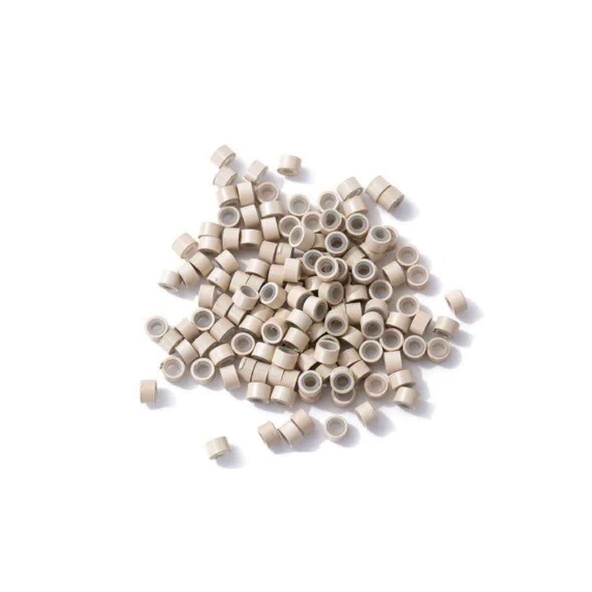 Blonde silicone lined micro rings scattered on a white background